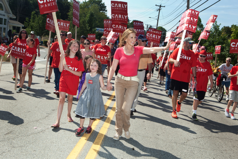 Republican presidential candidate Carly Fiorina marches with her family in the Labor Day parade on Sept. 7, 2015 in Milford, N.H. (Photo by Kayana Szymczak/Getty)