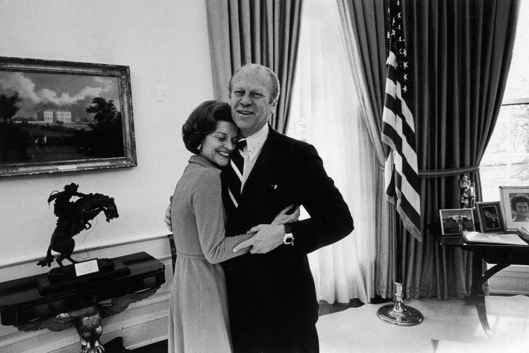 American President Gerald Ford and First Lady Betty Ford share a happy momnet as they hug each other in the White House's Oval Office, Washington D.C., Dec. 6, 1974. (Photo by David Hume Kennerly/White House/The LIFE Images Collection/Getty)