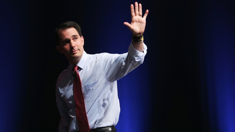 Republican presidential candidate Wisconsin Governor Scott Walker greets guests at The Family Leadership Summit at Stephens Auditorium on July 18, 2015 in Ames, Iowa. (Photo by Scott Olson/Getty)