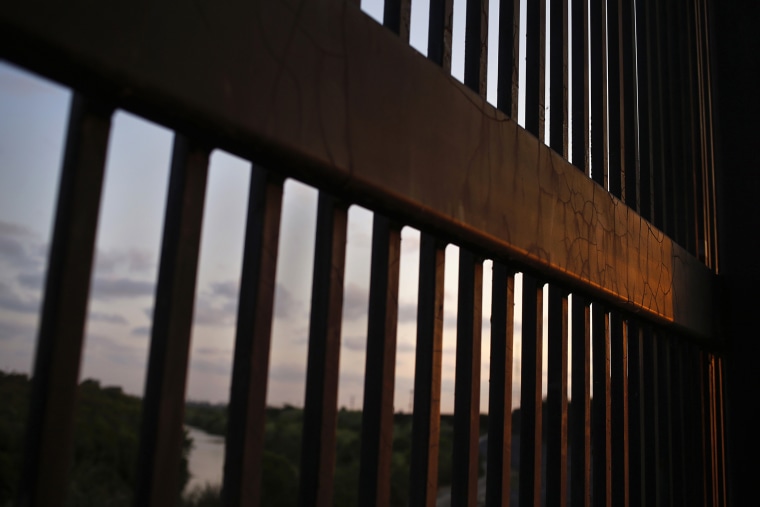 The border fence stands at the United States-Mexico border along the Rio Grande river in Brownsville, Texas. (Photo by Shannon Stapleton/Reuters)