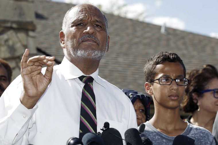 Ahmed Mohamed, 14, right, and his father Mohamed Elhassan Mohamed, left, thank supporters during a news conference at their home, Sept. 16, 2015, in Irving, Tex. (Photo by Brandon Wade/AP)