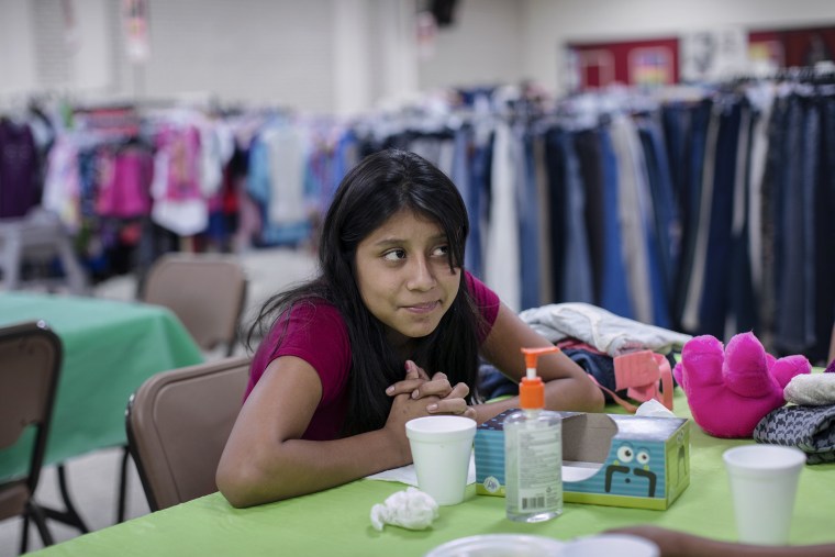 Donicia Martiliano Ramos, a 13-year-old immigrant from Guatemala, smiles at Sacred Heart Catholic Church in McAllen, Texas. (Photo by Bryan Schutmaat for MSNBC)