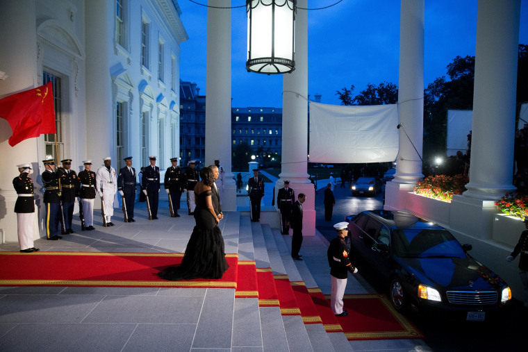 President Barack Obama and first lady Michelle Obama greet Chinese President Xi Jinping and his wife Peng Liyuan as they arrive for a State Dinner, Sept. 25, 2015, on the North Portico of the White House. (Photo by Andrew Harnik/AP)
