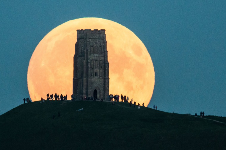 The supermoon rises behind Glastonbury Tor on Sept. 27, 2015 in Glastonbury, England.