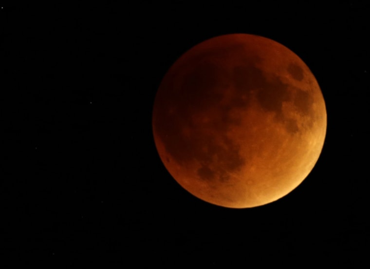 Earth's shadow obscures the view of a so-called supermoon during a total lunar eclipse, Sept. 27, 2015, near Lecompton, Kan. (Photo by Orlin Wagner/AP)