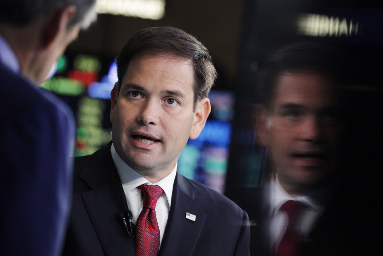 Republican presidential candidate, Sen. Marco Rubio, R-Fla., talks to CNBC correspondent John Harwood, left, during an interview at the New York Stock Exchange, Oct. 5, 2015. (Photo by Mark Lennihan/AP)