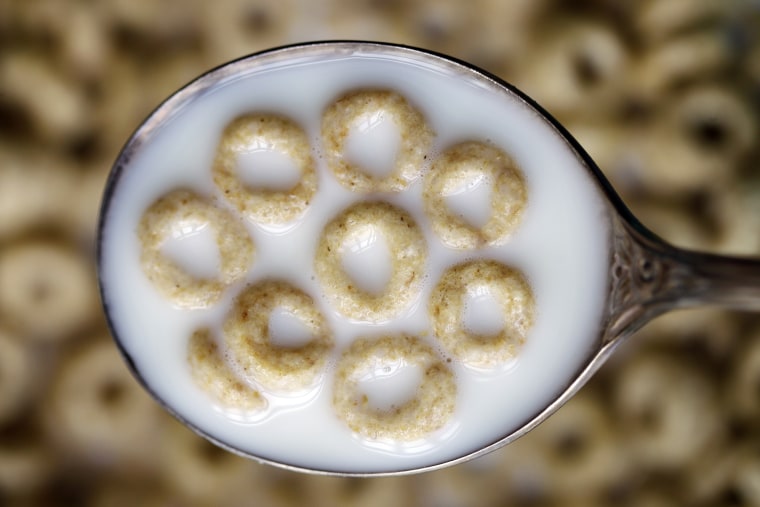 This June 15, 2011 file photo shows a spoonful of Honey Nut Cheerios in Pembroke, N.Y. (Photo by David Duprey/File/AP)