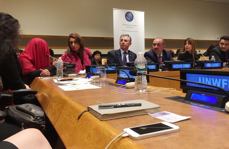 Bazi, a 20 year-old member of Iraq’s minority Yazidi population, testifies before a UN panel in New York, Oct. 7, 2015, wearing a red shawl to hide her identity. (Photo by Jamie Novogrod/MSNBC)