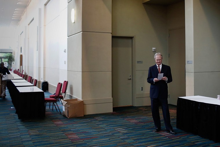 Potential Democratic presidential candidate former Sen. Lincoln Chafee (D-RI) reads his notes before speaking at the South Carolina Democratic Party state convention April 25, 2015 in Columbia, SC. (Photo by Win McNamee/Getty)