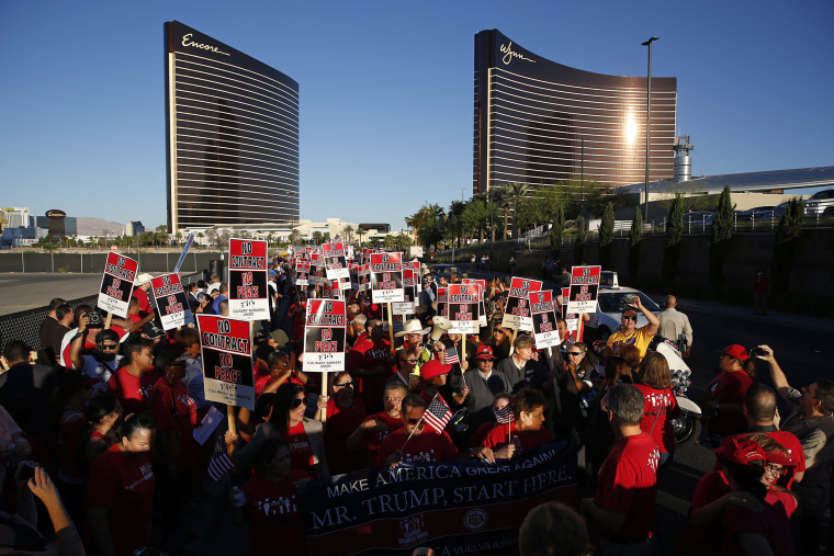People chant during a rally in front of the Trump Hotel Monday, Oct. 12, 2015, in Las Vegas. (Photo by John Locher/AP)