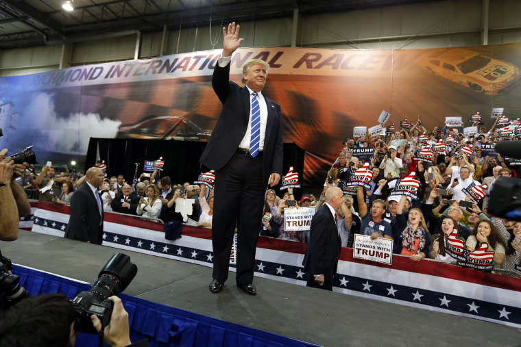 Republican presidential hopeful Donald Trump waves to a group of supporters as he attends a campaign rally in Richmond, Va., Oct. 14, 2015. (Photo by Steve Helber/AP)