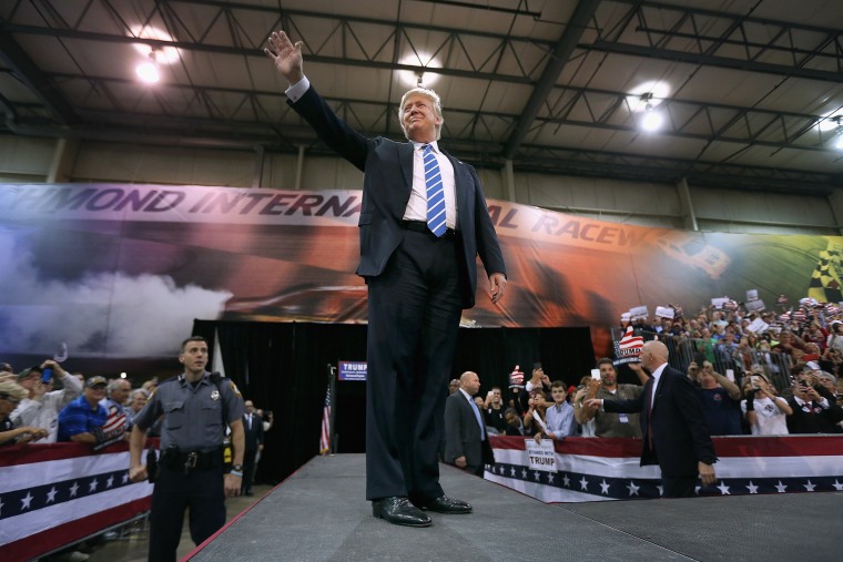 Republican presidential candidate and front-runner Donald Trump walks out on stage during a campaign rally at the Richmond International Raceway on Oct. 14, 2015 in Richmond, Va. (Photo by Chip Somodevilla/Getty)