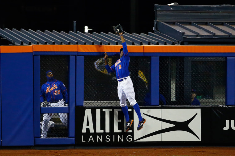 Curtis Granderson #3 of the New York Mets catches a pop up fly hit by Chris Coghlan #8 of the Chicago Cubs in the second inning against Noah Syndergaard #34 of the New York Mets during game two (Photo by Al Bello/Getty)