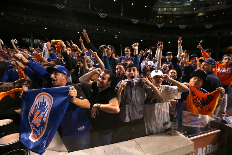New York Mets fans cheer after game four of the 2015 MLB National League Championship Series at Wrigley Field on Oct. 21, 2015 in Chicago, Ill. (Photo by Jonathan Daniel/Getty)
