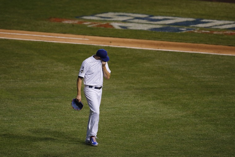 Chicago Cubs pitcher Jason Hammel wipe his face after being relieved during the second inning of Game 4 of the National League baseball championship series against the New York Mets, Oct. 21, 2015, in Chicago. (Photo by Charles Rex Arbogast/AP)