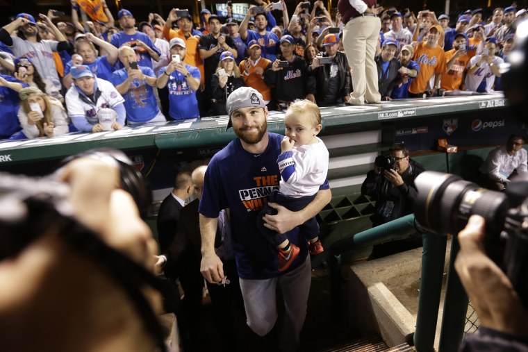 New York Mets' Daniel Murphy celebrates after Game 4 of the National League baseball championship series against the Chicago Cubs Wednesday, Oct. 21, 2015, in Chicago. (Photo by David Goldman/AP)