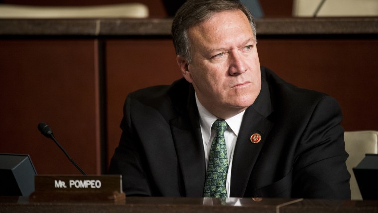 Rep. Mike Pompeo listens during the House Select Committee on the Events Surrounding the 2012 Terrorist Attack in Benghazi hearing, Sep. 17, 2014. (Photo By Bill Clark/CQ Roll Call/Getty)