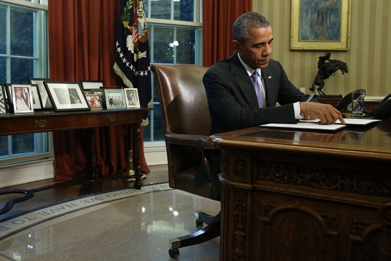 U.S. President Barack Obama signs a veto of H.R. 1735 National Defense Authorization Act (NDAA) in the Oval Office, Oct. 22, 2015 in Washington, DC. (Photo by Mark Wilson/Getty)