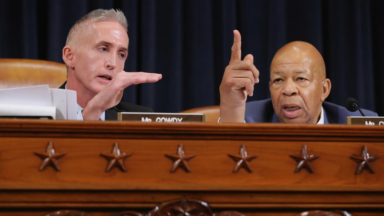 House Select Committee on Benghazi Chairman Trey Gowdy (R-SC) (L) and ranking member Rep. Elijah Cummings (D-MD) argue while Hillary Clinton testifies October 22, 2015 on Capitol Hill in Washington, DC. (Photo by Chip Somodevilla/Getty)