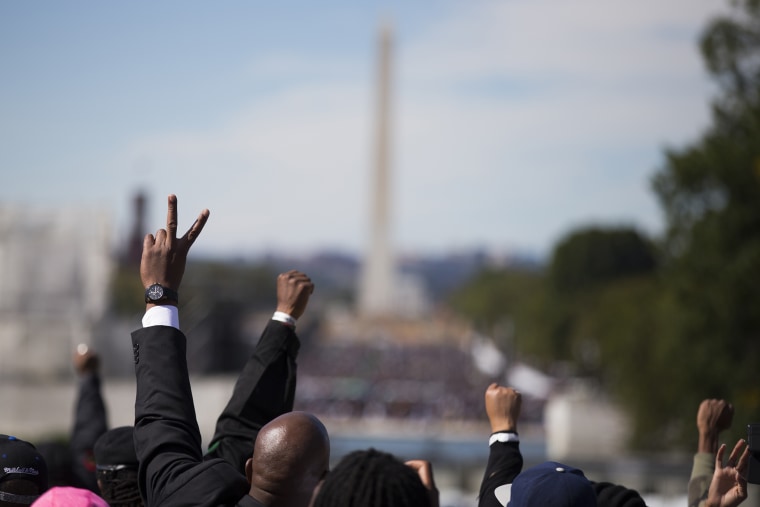 People put their hands in the air during a rally to mark the 20th anniversary of the Million Man March, on Capitol Hill, on Oct. 10, 2015, in Washington. (Photo by Evan Vucci/AP)