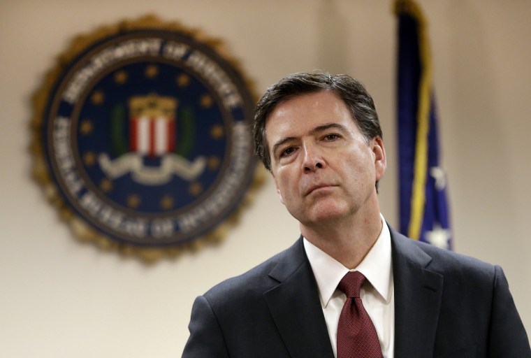 FBI Director James B. Comey listens to a question from a reporter during a media conference in San Francisco, Calif., Feb. 27, 2014. (Photo by Ben Margot/AP)