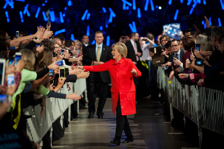 Democratic presidential candidate Hillary Clinton greets the crowd as she walks to the stage at the Jefferson-Jackson Dinner in Des Moines, Ia., on Oct. 24, 2015. (Photo by Mark Kauzlarich/Reuters)