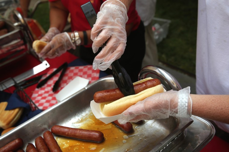 Hotdogs are prepared at an event in Washington, D.C. (Photo by Alex Wong/Getty)