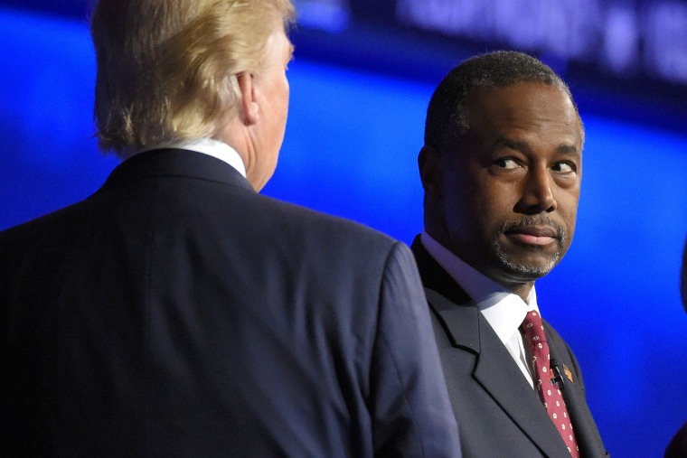 Ben Carson watches as Donald Trump takes the stage during the CNBC Republican presidential debate at the University of Colorado, Oct. 28, 2015, in Boulder, Colo. (Photo by Mark J. Terrill/AP)