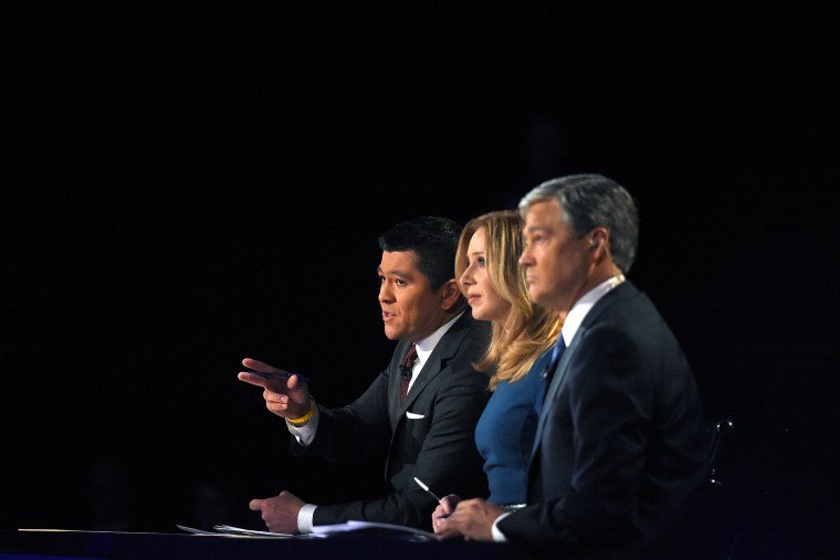 Debate moderators (from left) Carl Quintanilla, Becky Quick and John Harwood appear during the CNBC Republican presidential debate at the University of Colorado, Oct. 28, 2015, in Boulder, Colo. (Photo by Mark J. Terrill/AP)