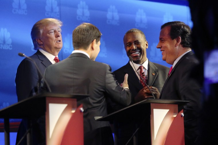 Donald Trump, Sen. Marco Rubio, Ben Carson and Gov. Chris Christie gather to talk during a break in the debate of Republican presidential hopefuls at the University of Colorado in Boulder, Oct. 28, 2015. (Photo by Jim Wilson/The New York Times/Redux)