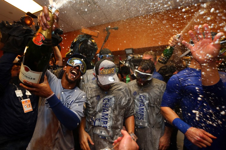 The Kansas City Royals celebrate in the clubhouse after defeating the New York Mets to win Game Five of the 2015 World Series at Citi Field on Nov. 1, 2015 in the Flushing neighborhood of the Queens borough of New York, N.Y. (Photo by Elsa/Getty)