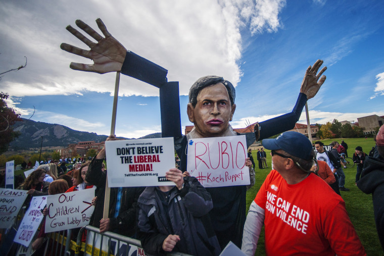 Students and protesters gather at the \"Free Speech Zone\" across the street from CNBC's U.S. Republican presidential debate in Boulder, Colo., Oct. 28, 2015. (Photo by Evan Semon/Reuters)