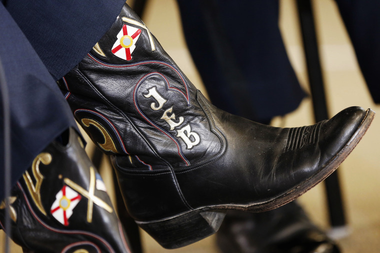 Republican presidential candidate, former Florida Gov. Jeb Bush, wears custom made boots during a campaign stop with area law enforcement officers, Nov. 4, 2015, in Goffstown, N.H. (Photo by Jim Cole/AP)