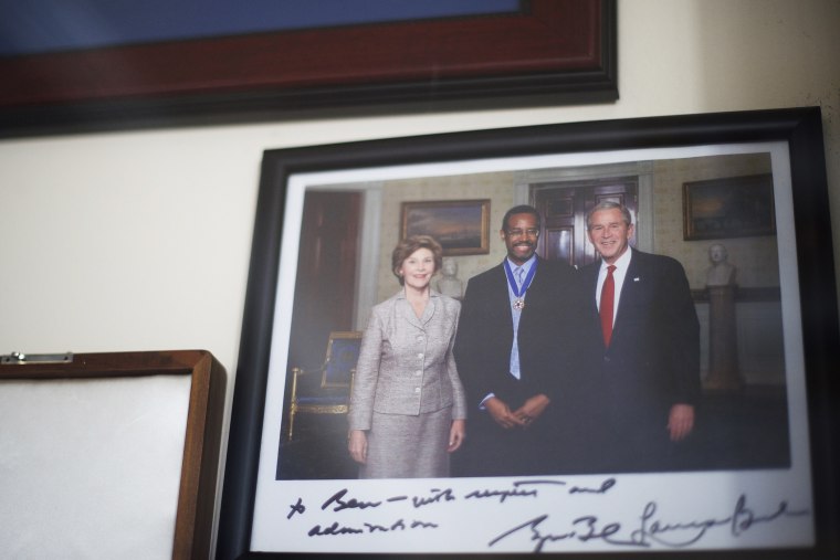 A signed photo with former president George W. Bush hangs in Dr. Benjamin Carson's residence in Upperco, Md. on Nov. 27, 2014. (Photo by Mark Makela)