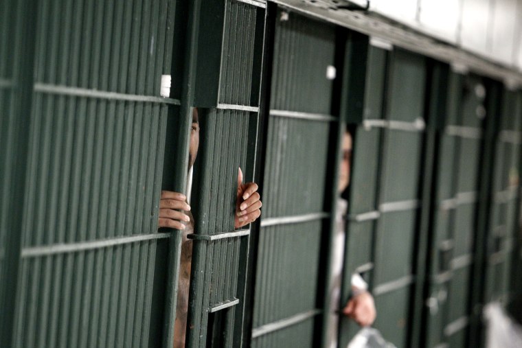 Prison bars on Oct. 3, 2012. (Photo by Reed Saxon/AP)