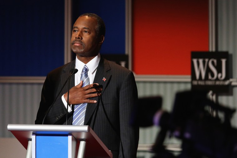 Presidential candidate Ben Carson pauses during the Star Spangled Banner in the opening of the Republican Presidential Debate at the Milwaukee Theatre Nov. 10, 2015 in Milwaukee, Wis. (Photo by Scott Olson/Getty)