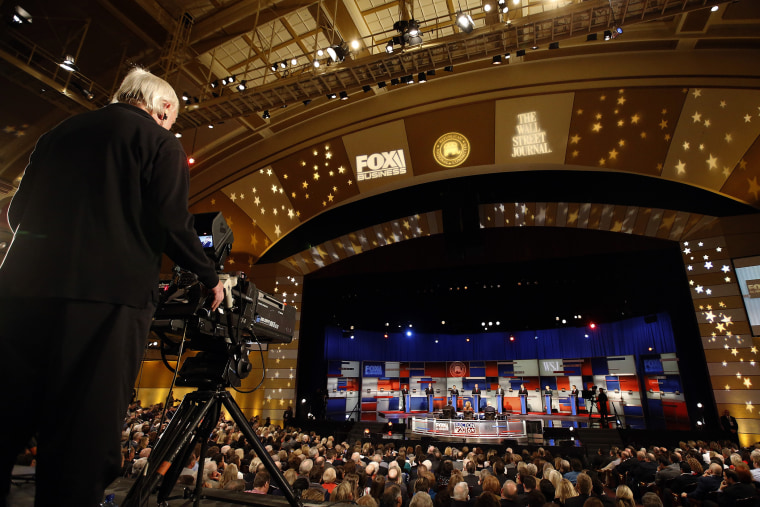 A cameraman films the top Republican presidential candidates during Republican presidential debate at Milwaukee Theatre, Nov. 10, 2015, in Milwaukee, Wis. (Photo by Morry Gash/AP)