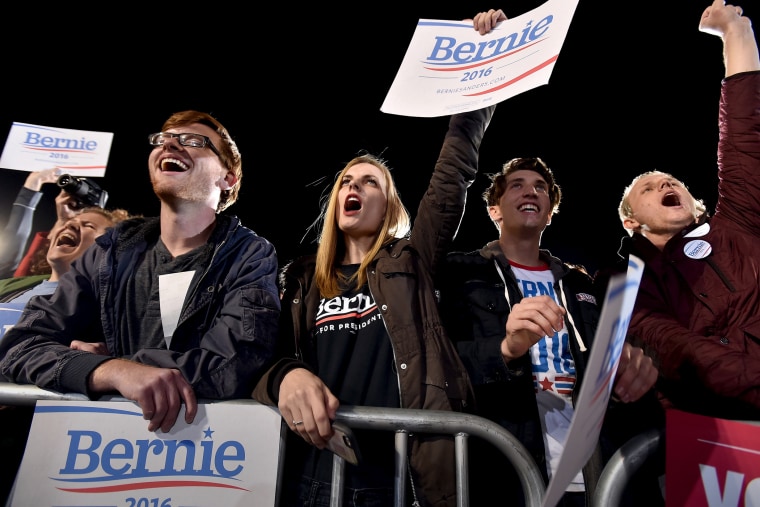 Supporters of U.S. Democratic presidential candidate Senator Bernie Sanders cheer as he speaks at a rally in North Las Vegas, Nev., Nov. 8, 2015. (Photo by David Becker/Reuters)