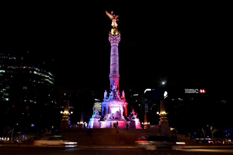 The Angel de la Independencia monument is lit up in blue, white and red, the colors of the French flag, following the Paris terror attacks, in Mexico City, Nov. 14, 2015. (Photo by Tomas Bravo/Reuters)