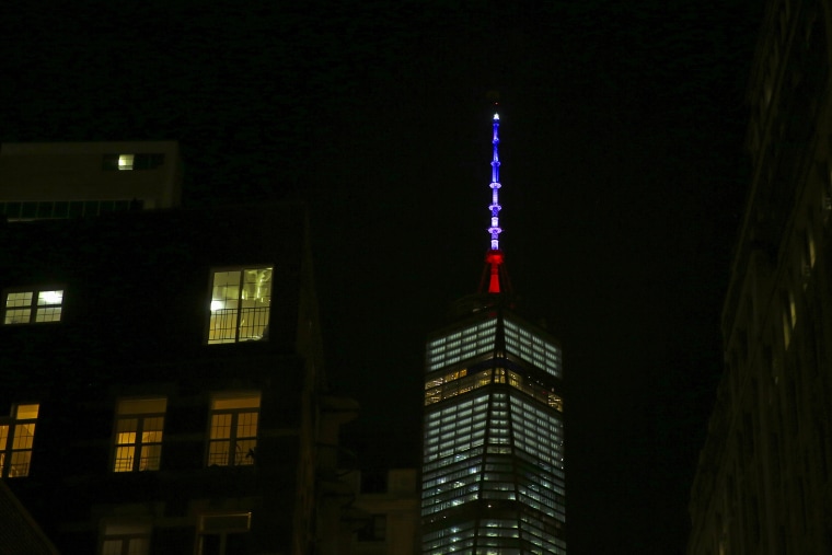 One World Trade Center is lit in the Blue, White and Red colors of the French flag in honor of the victims of the attacks in Paris, in the Manhattan borough of New York Nov. 13, 2015. (Photo by Carlo Allegri/Reuters)