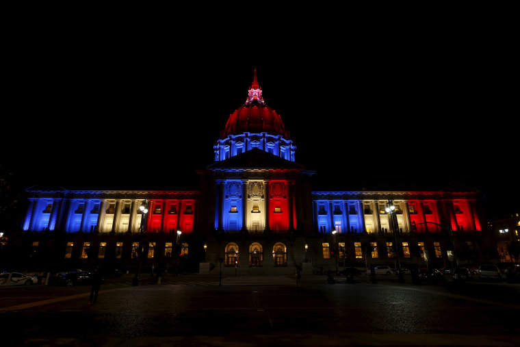 San Francisco City Hall is lit up with blue, white and red, the colors of the French flag, following the Paris terror attacks, in San Francisco, Calif., Nov. 13, 2015. (Photo by Stephen Lam/Reuters)