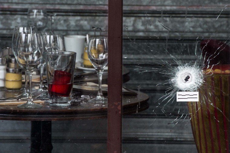 Bullet holes and marks are seen on the windows of the Cafe Bonne Biere restaurant on Nov. 14, 2015 in Paris, France. (Photo by David Ramos/Getty)