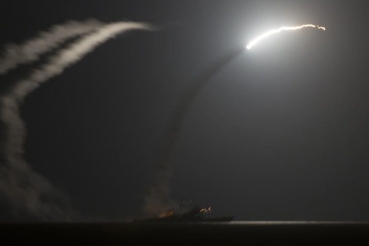 A handout picture released by the US Navy shows the guided-missile cruiser USS Philippine Sea (CG 58) launching a Tomahawk cruise missile against IS (Islamic State) targets in Syria, as seen from the aircraft carrier USS George H.W. Bush (CVN 77) in the A