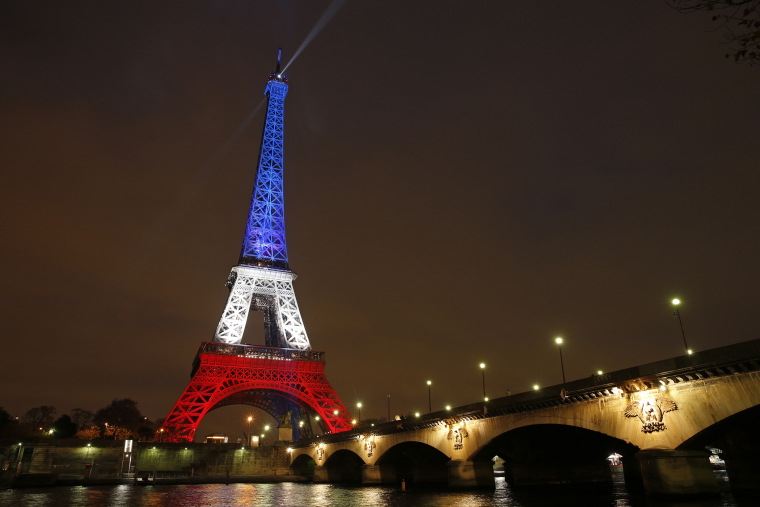 The Eiffel Tower is lit with the blue, white and red colors of the French flag in Paris, France, Nov. 16, 2015, to pay tribute to the victims of a series of deadly attacks on Friday in the French capital. (Photo by Benoit Tessier/Reuters)