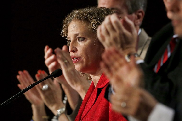 During a standing ovation, Democratic National Committee chair, Rep. Debbie Wasserman Schultz, D-Florida, speaks to party members during their summer meeting on, Aug. 23, 2013, in Scottsdale, Ariz. (Photo by Ross D. Franklin/AP)