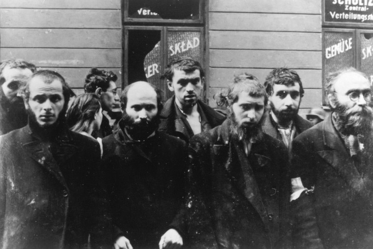 A group of religious Jews are held under arrest by German SS soldiers, April/May 1943, during the destruction of the Warsaw Ghetto by German troops, following an uprising in the Jewish quarter. (Photo by AP)