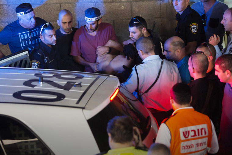 Israeli police arrest a Palestinian identified as Raed Khalil bin Mahmoud, a 36-year-old from the West Bank village of Dura in Tel Aviv, Israel, Nov. 19, 2015. (Photo by Moti Milrod/AP)