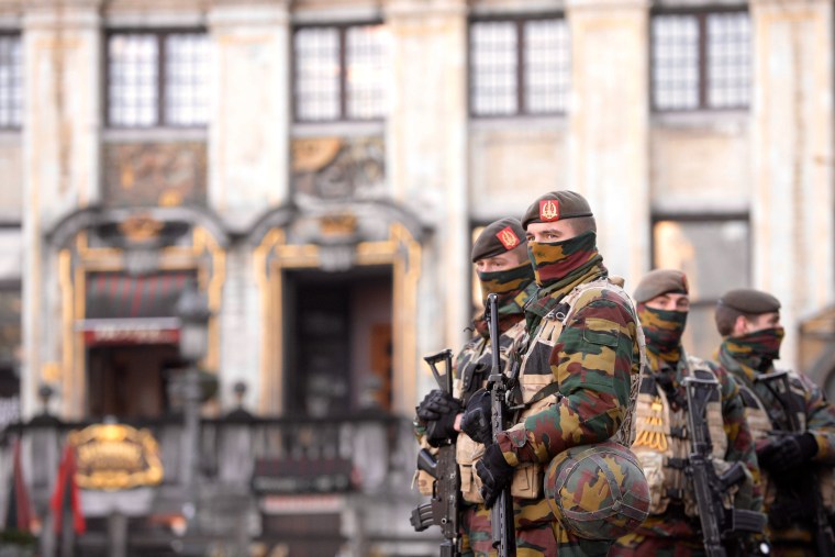 Soldiers and police patrol the city center in Brussels on Nov. 23, 2015. (Photo by Jakub Dospiva/CTK/AP)