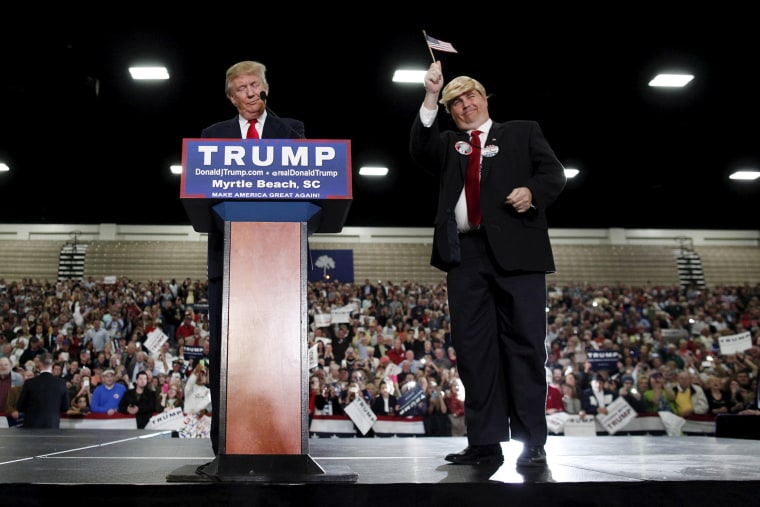 U.S. Republican presidential candidate Donald Trump brings look-a-like supporter on stage during a rally at the Myrtle Beach Convention Center in Myrtle Beach, S.C., Nov. 24, 2015. (Photo by Randall Hill/Reuters)