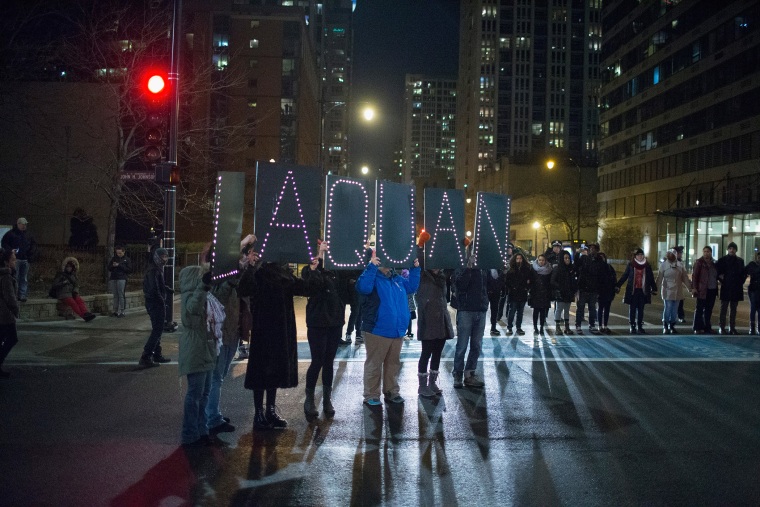 Demonstrators march through downtown following the release of a video showing Chicago Police officer Jason Van Dyke shooting and killing Laquan McDonald on Nov. 24, 2015 in Chicago, Ill. (Photo by Scott Olson/Getty)